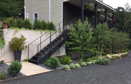 architectural stainless steel horizontal rod rail system and corten steal flower-bed edging
