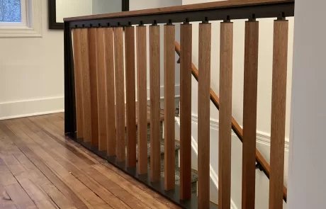 metal and wood second floor landing rail