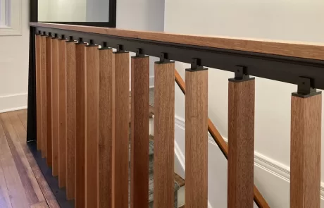 metal and wood second floor landing rail