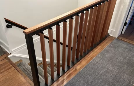 metal and wood second floor landing rail